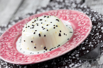 Classical panna cotta with white and black chocolate