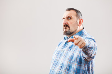 Portrait of angry man pointing