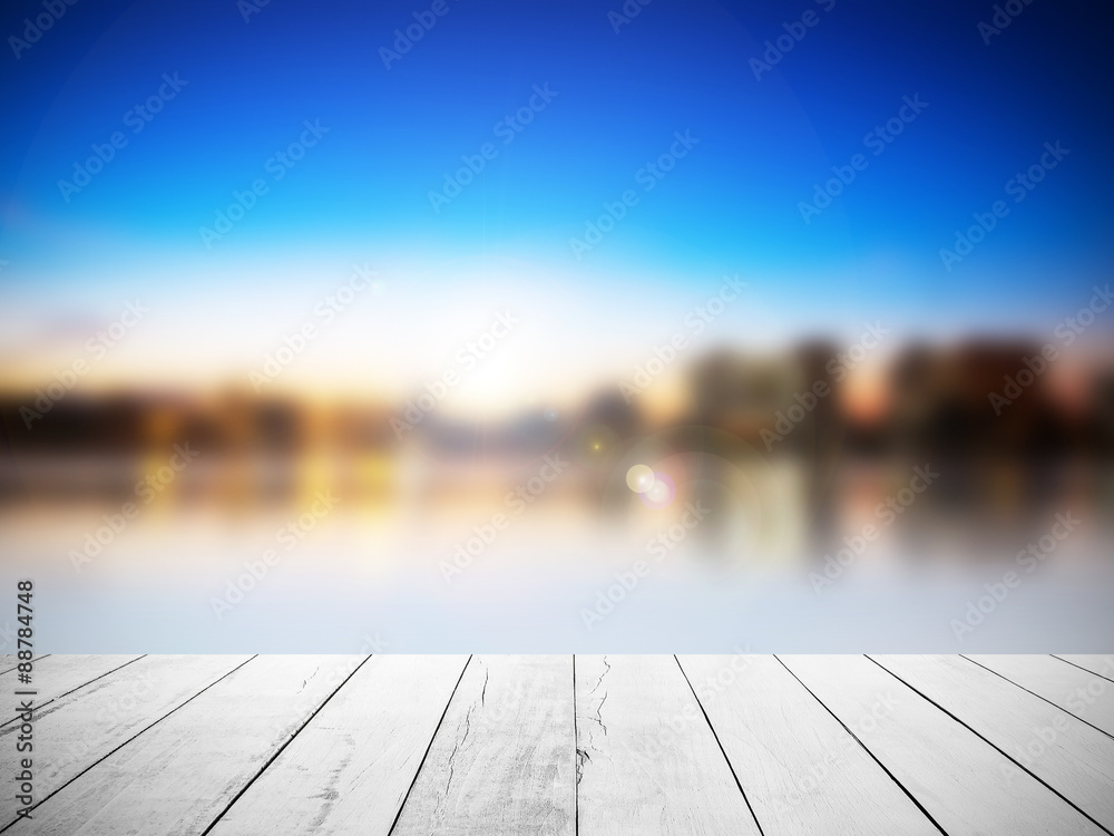 Wall mural white wood floor with blurred sunlight sky background