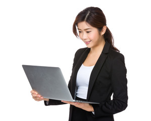 Asian Young businesswoman use of the laptop computer