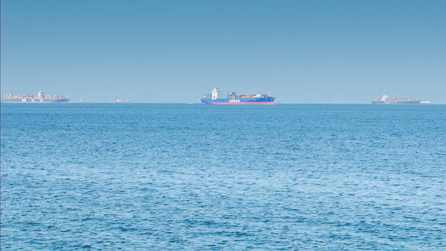 Cargo ships in the sea, time lapse