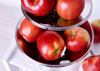 Tasty ripe apples on serving tray close up