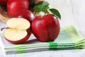 Ripe red apples on table close up
