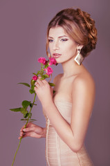 Studio portrait of a beautiful dark blond woman with evening hai