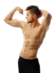 Fototapeta premium Muscle young man isolated on white