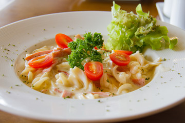 Pasta Carbonara with cherry tomatoes bacon and cheese
