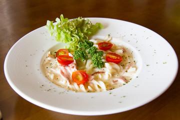 Pasta Carbonara with cherry tomatoes bacon and cheese
