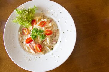 Pasta Carbonara with cherry tomatoes bacon and cheese