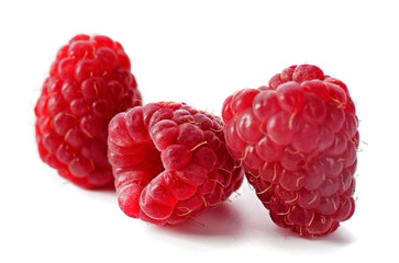 Red sweet raspberries isolated on white