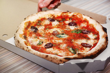 Delicious pizza in box, closeup