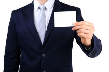 Elegant man in suit with business card isolated on white