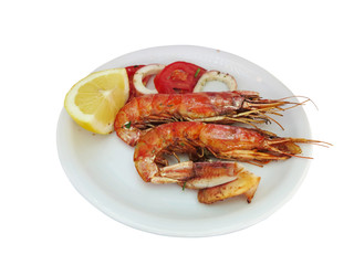 fresh shrimp and lemon on dish isolated over white