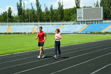 Young people jogging on stadium