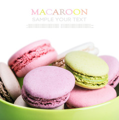 Sweet and colourful french macaroons on white
