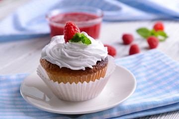 Delicious cupcake with berries on table close up