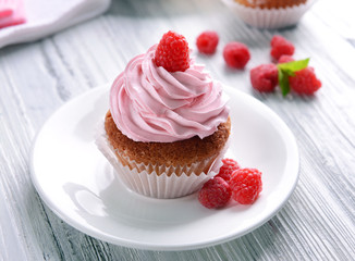 Delicious cupcake with berries on table close up