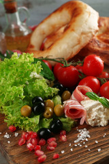 Ingredients of Mediterranean cuisine, on wooden board, close-up