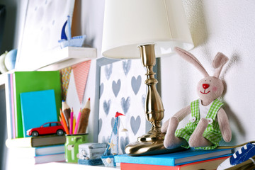 Shelves with toys in child room close-up