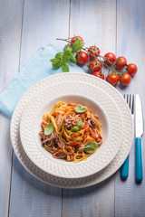 tagliolini with squid and fresh tomatoes