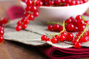 Fresh red currants on table close up
