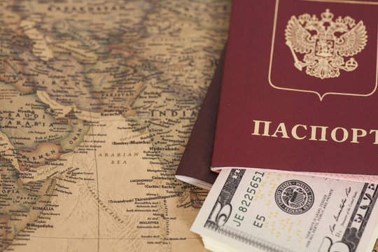 Russian International passports with dollars on  world map