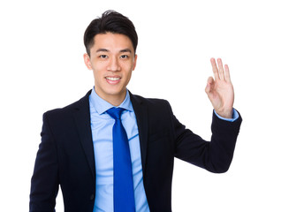 Young businessman with ok sign gesture