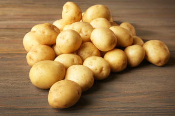 New potatoes on wooden background
