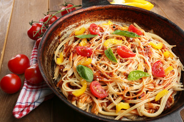 Homemade Spaghetti Bolognese on pan, on wooden background