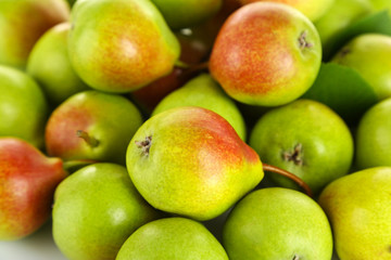 Heap of ripe tasty pears close up