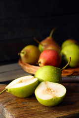 Ripe tasty pears on table close up