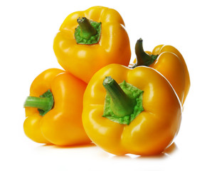 Group of yellow peppers isolated on white