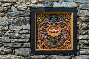 Chinese wooden window decorated inside with stone wall.