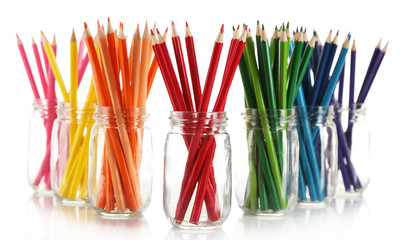 Bright pencils in glass jars, isolated on white