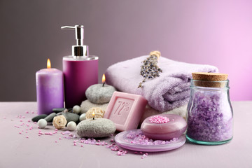Fototapeta na wymiar Spa treatments on colorful background. Lavender spa concept