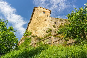 Fototapeta na wymiar XI Century fortress guarding village in the Italian countryside