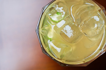 glass of delicious alcoholic cocktails or lemonade with ice and