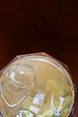 glass of delicious alcoholic cocktails or lemonade with ice and