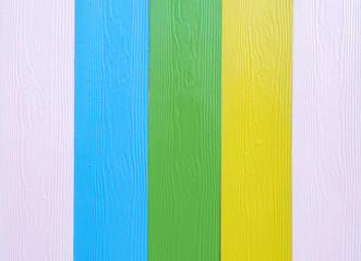 Colorful wood board at the fence texture background