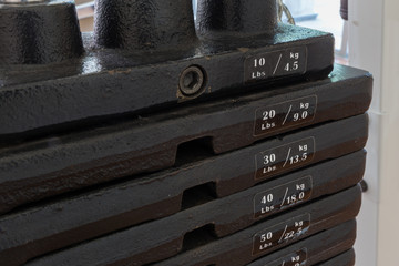 Fototapeta na wymiar Iron Plates of Weight Training Equipment / Plates of Weight Training Machine