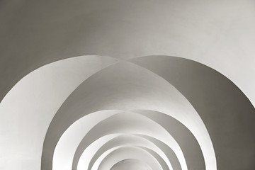 white arched ceiling with geometric shadows as background