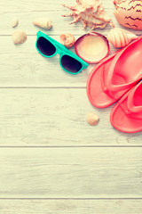 Beach accessories on wooden board.