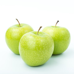Green apples on a white background