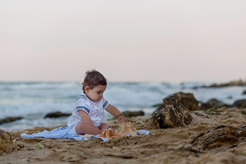 Fototapeta na wymiar Baby boy on the beach