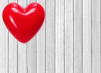 red heart on white wooden background