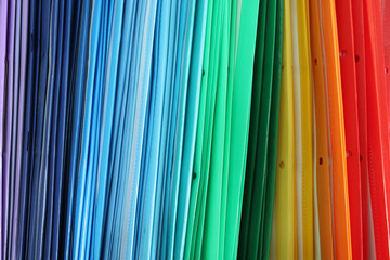 a pile of multicolored folders