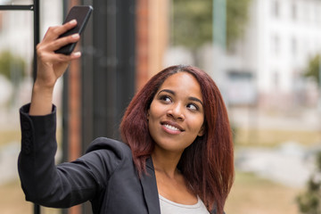 Businesswoman Taking Selfie Outside the Office