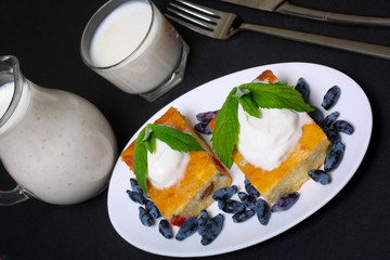 Appetizing cottage cheese casserole with berries and sour cream