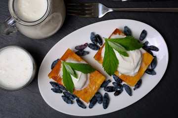 Appetizing cottage cheese casserole with berries and sour cream