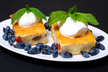 Appetizing cottage cheese casserole with berries and sour cream