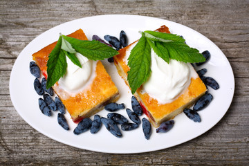 Appetizing cottage cheese casserole with berries and sour cream